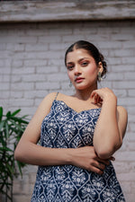 Load image into Gallery viewer, Blue printed sleeveless spaghetti strap top with white leaf-like patterns