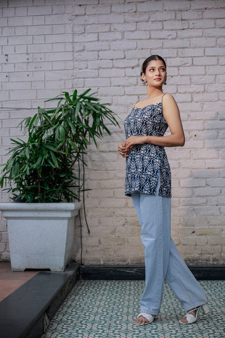 Blue printed sleeveless spaghetti strap top with white leaf-like patterns