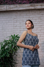 Load image into Gallery viewer, Blue printed sleeveless spaghetti strap top with white leaf-like patterns
